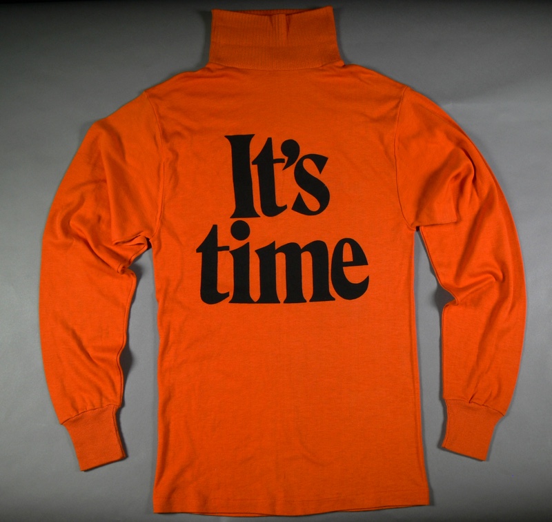 An orange skivvy with the words 'It's time' in bold black letters. An orange skivvy with the words 'It's time' in bold black letters.