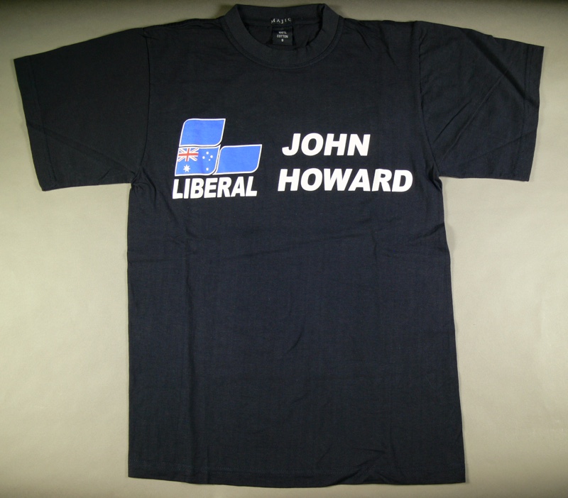 A dark t-shirt with the Liberal Party logo and the words 'John Howard'. A dark t-shirt with the Liberal Party logo and the words 'John Howard'.