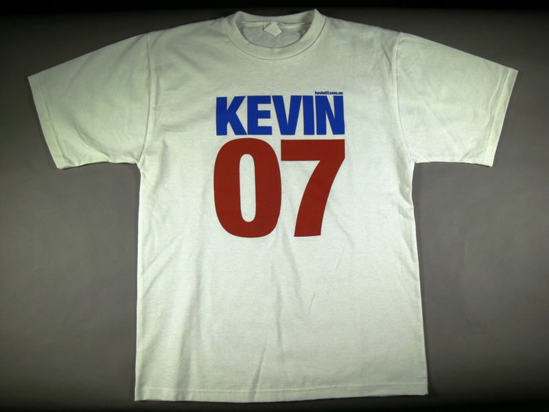 A white t-shirt with the words 'Kevin' in blue and '07' in red. A white t-shirt with the words 'Kevin' in blue and '07' in red.