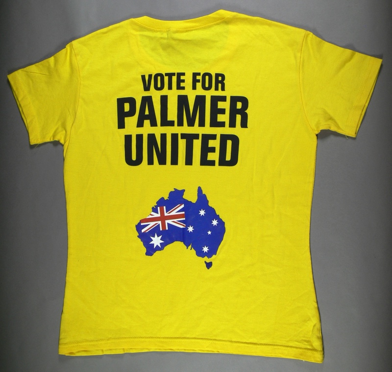 A yellow t-shirt with the words 'Vote for Palmer United' and a silhouette of Australia coloured with the Australian flag. A yellow t-shirt with the words 'Vote for Palmer United' and a silhouette of Australia coloured with the Australian flag.
