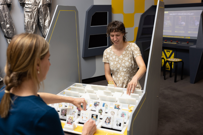 Visitors playing a game made from the cartoons