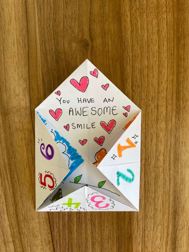 A chatterbox decorated with textas. A chatterbox decorated with textas.