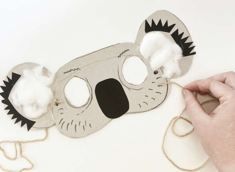 A face mask of a koala with cotton wool in the ears. A face mask of a koala with cotton wool in the ears.