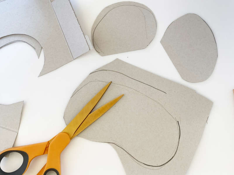 A piece of cardboard cut out into a koala shape. A piece of cardboard cut out into a koala shape.