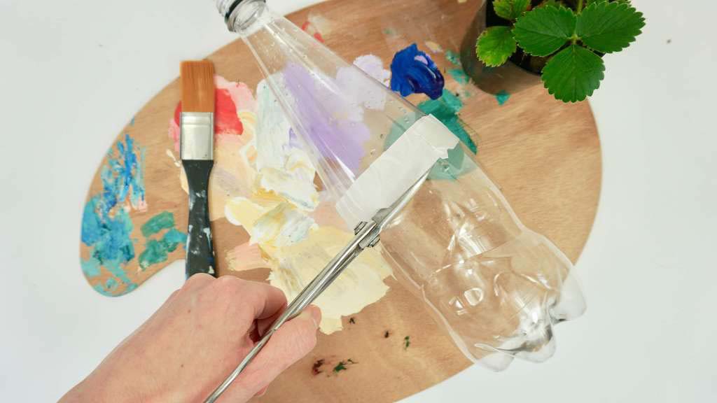 A paint palette, a plastic bottle, paint brushes and a little herb pot. A paint palette, a plastic bottle, paint brushes and a little herb pot.