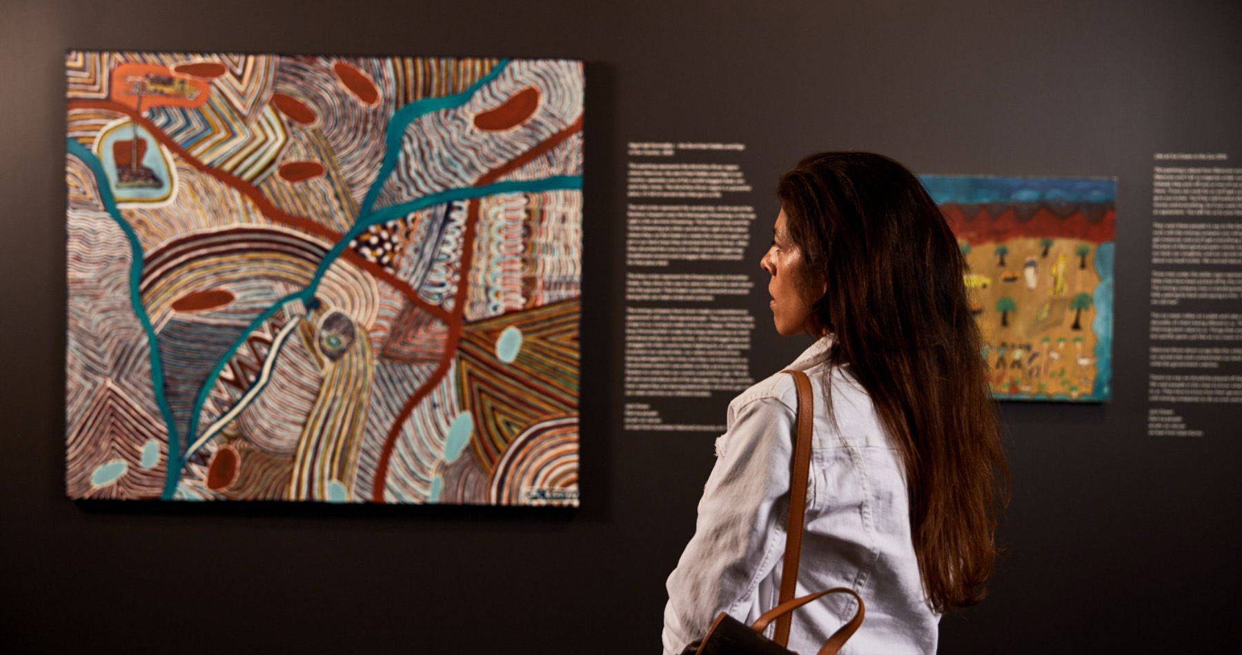 A woman looking at one of the features A woman looking at one of the features