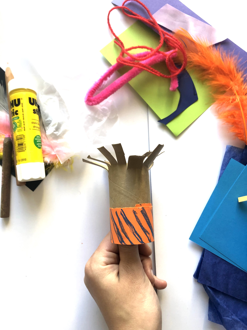 Toilet roll with the top cut into strips to represent hair and orange paper wrapped around the bottom. Toilet roll with the top cut into strips to represent hair and orange paper wrapped around the bottom.