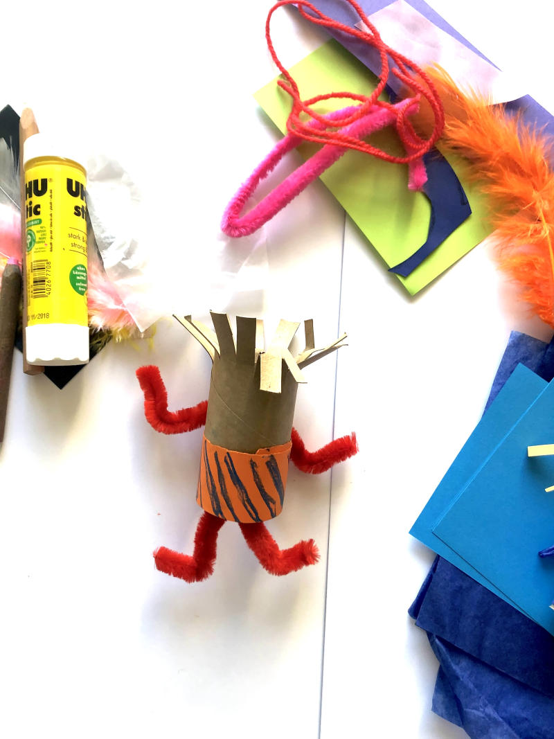Toiler toll with top cut into strips to represent hair and pipe cleaner arms and legs. Toiler toll with top cut into strips to represent hair and pipe cleaner arms and legs.