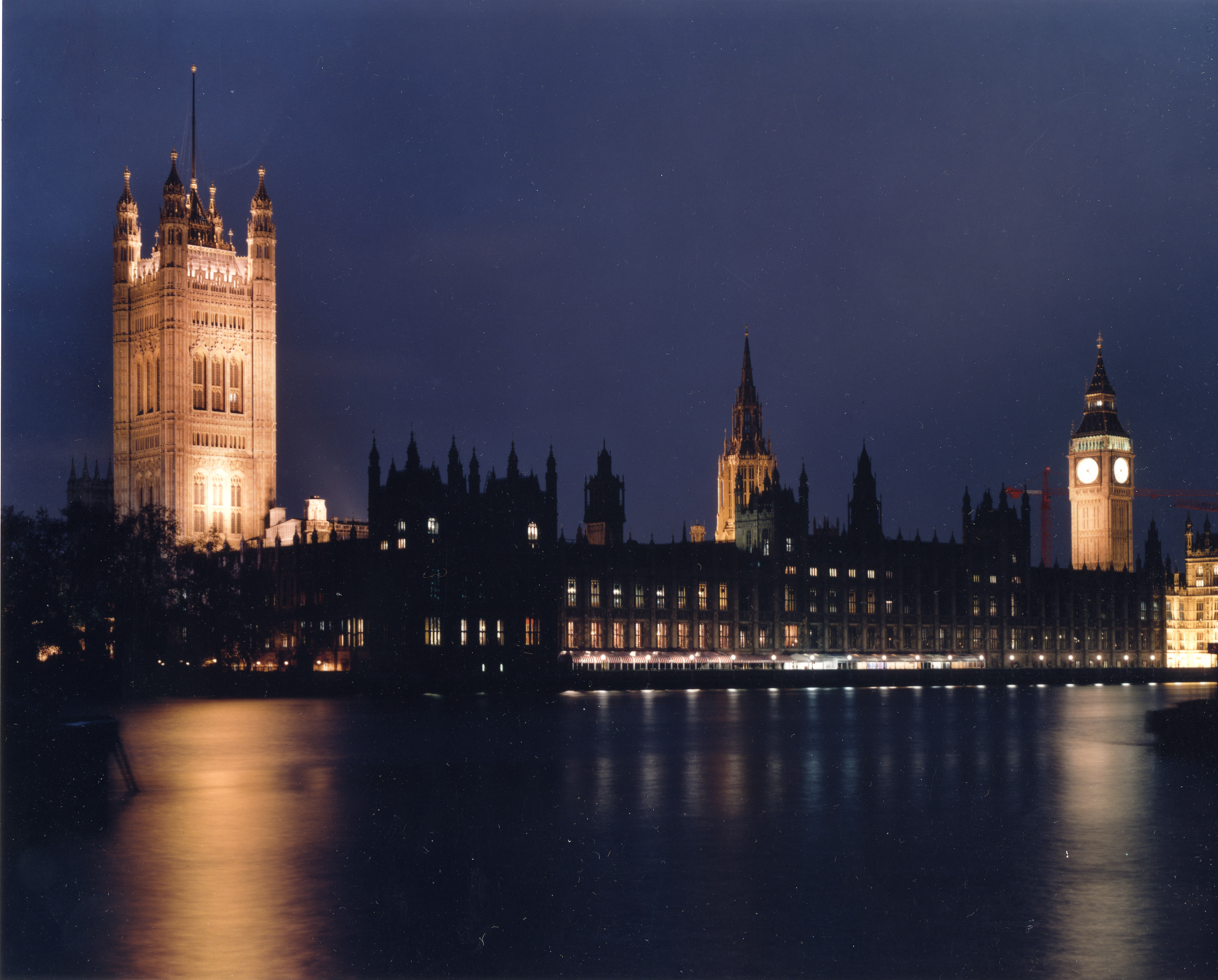 Westminster Abbey, London, at night from across the Thames River. Westminster Abbey, London, at night from across the Thames River.