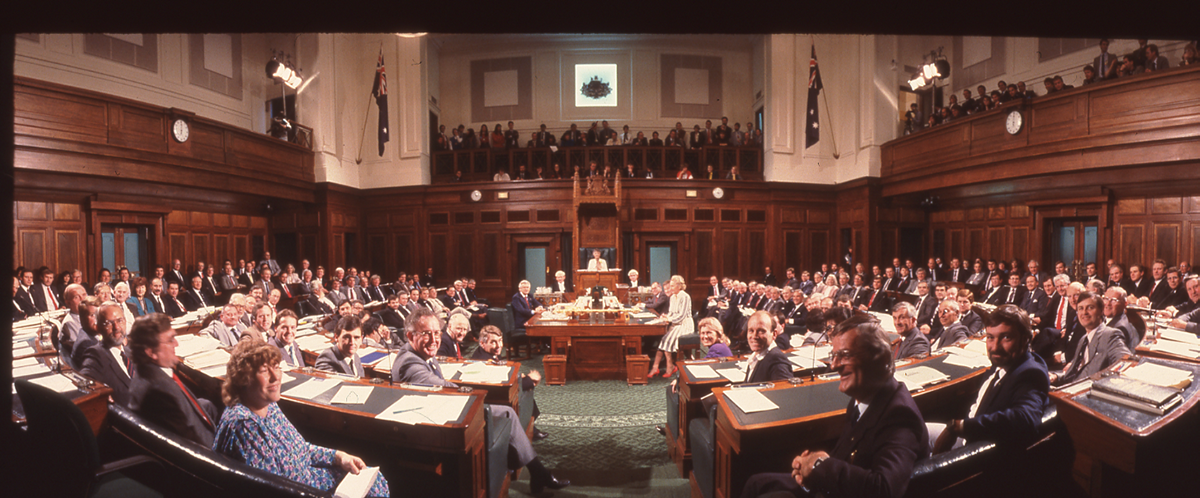 A colour photograph of the House of Representatives Chamber filled with seated politicians A colour photograph of the House of Representatives Chamber filled with seated politicians