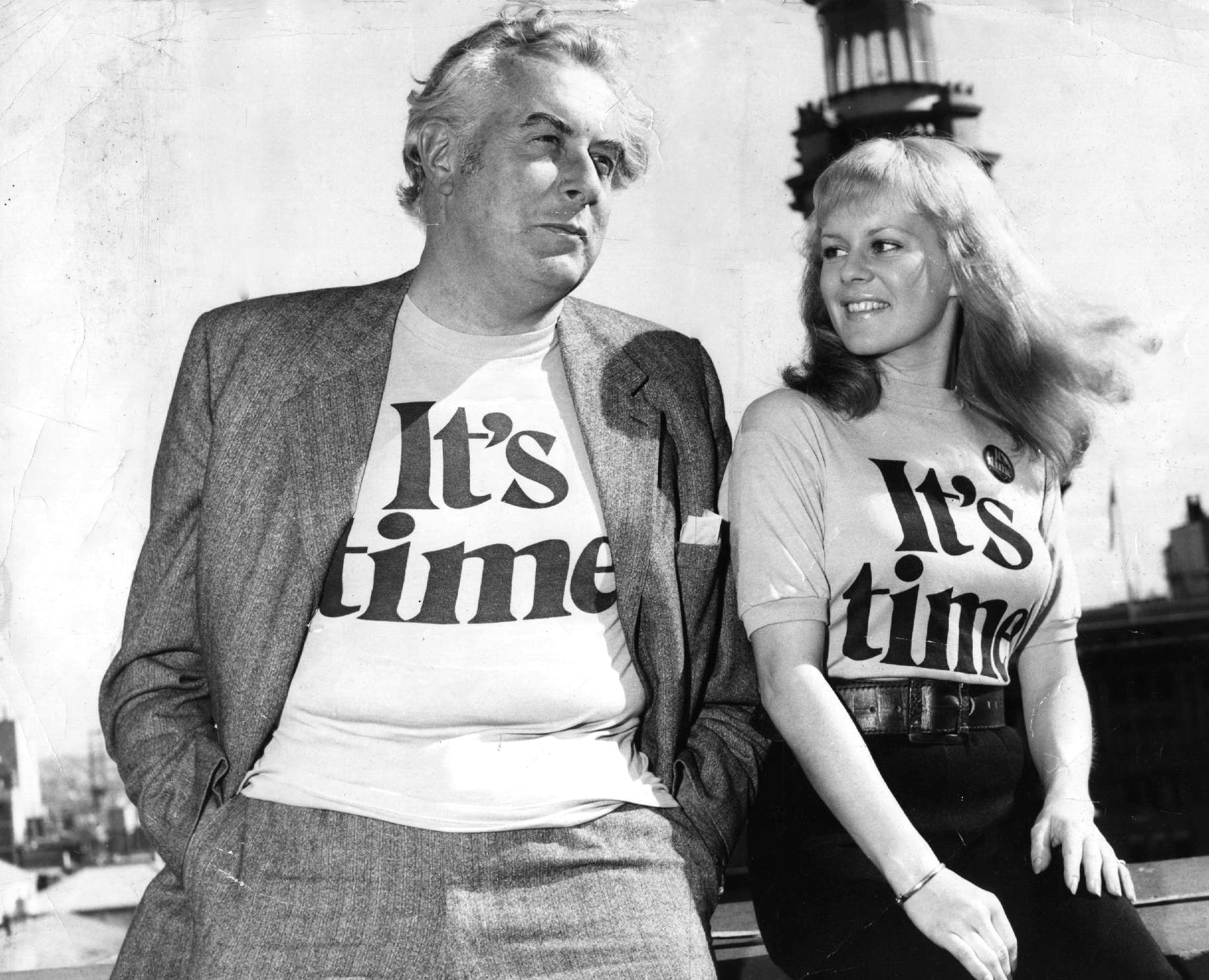 A relaxed Gough Whitlam and a smiling Patricia Amphlett posing together in t-shirts emblazoned with the words ‘It’s time’. A relaxed Gough Whitlam and a smiling Patricia Amphlett posing together in t-shirts emblazoned with the words ‘It’s time’.