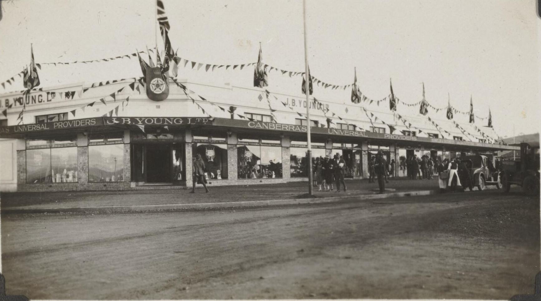 A department store, J B Young Ltd, decorated with flags and bunting. A department store, J B Young Ltd, decorated with flags and bunting.