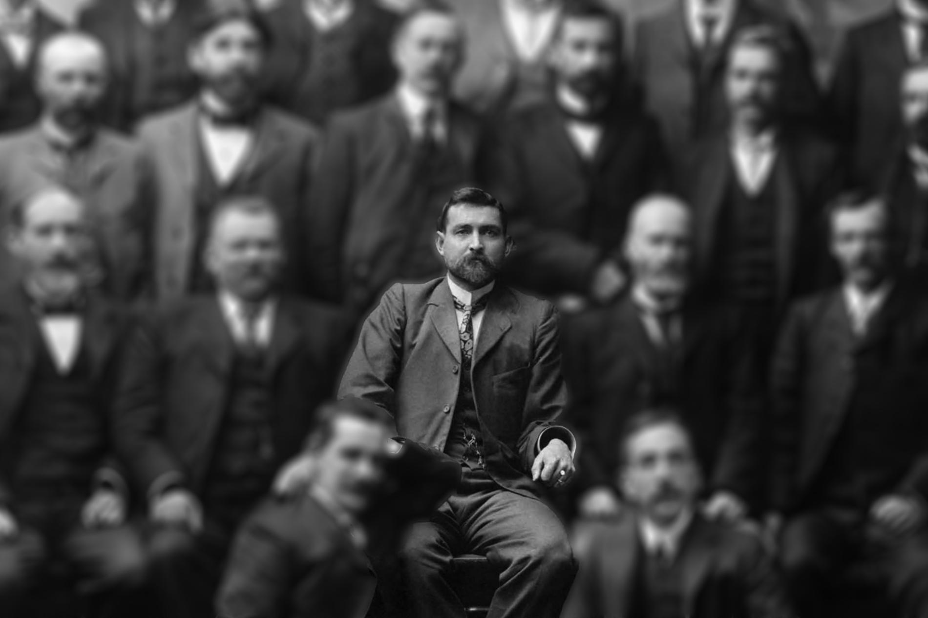 Chris Watson, sitting in a group photo where all the other people have been blurred out. Chris Watson, sitting in a group photo where all the other people have been blurred out.