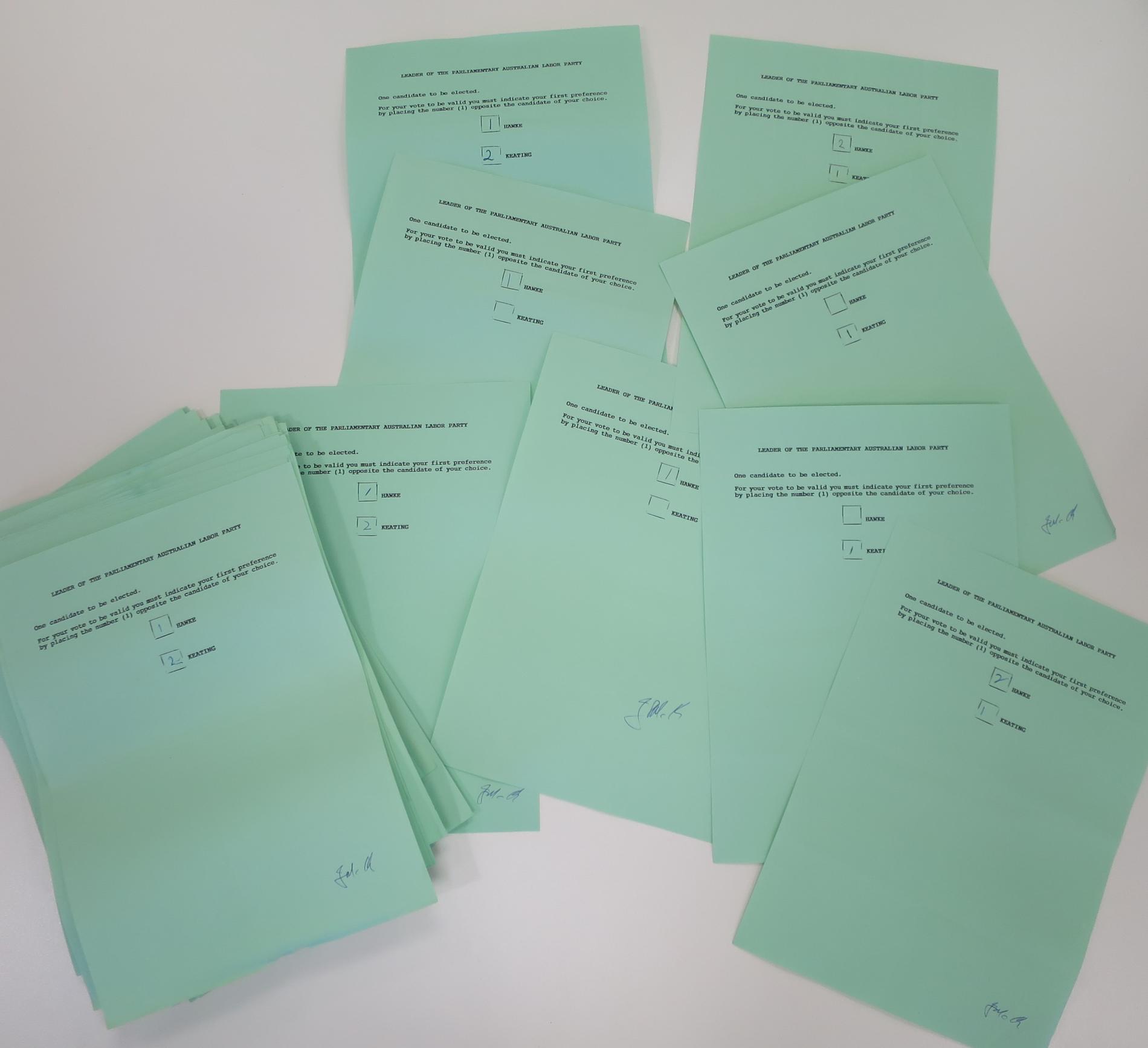 A pile of green ballot papers with two names listed: HAWKE and KEATING. A pile of green ballot papers with two names listed: HAWKE and KEATING.