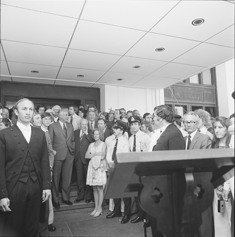 A crowd, including Prime Minister Gough Whitlam, on the steps of Parliament House. A crowd, including Prime Minister Gough Whitlam, on the steps of Parliament House.