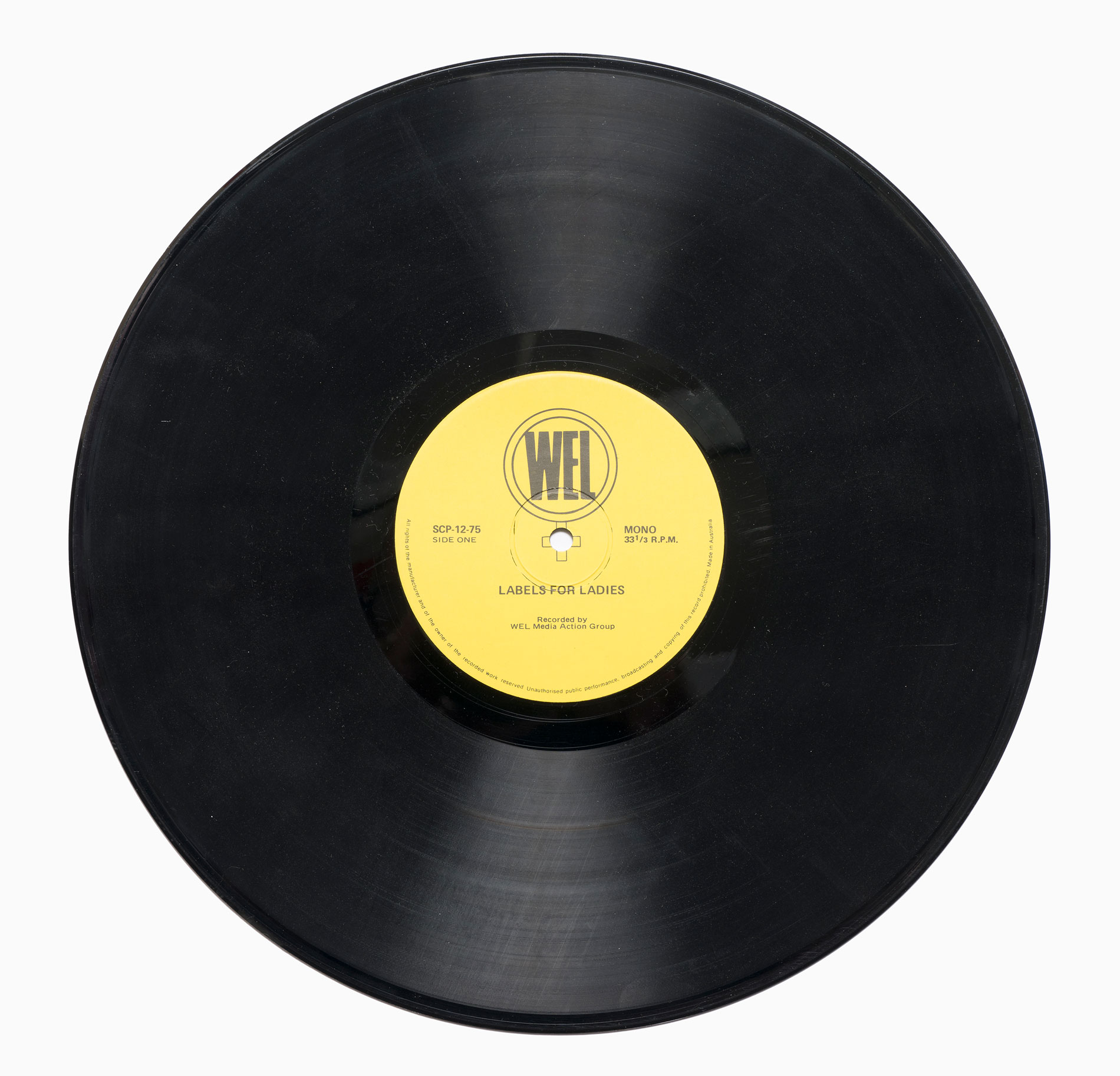 A black vinyl record with a yellow label that reads 'WEL: labels for ladies'.