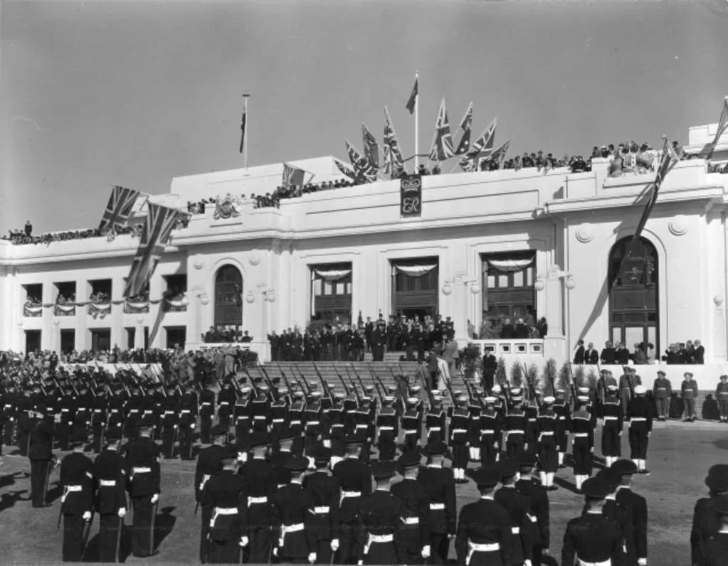 The Governor-General Sir William Slim addresses members of the defence forces from the front steps of Parliament House on coronation day. The Governor-General Sir William Slim addresses members of the defence forces from the front steps of Parliament House on coronation day.