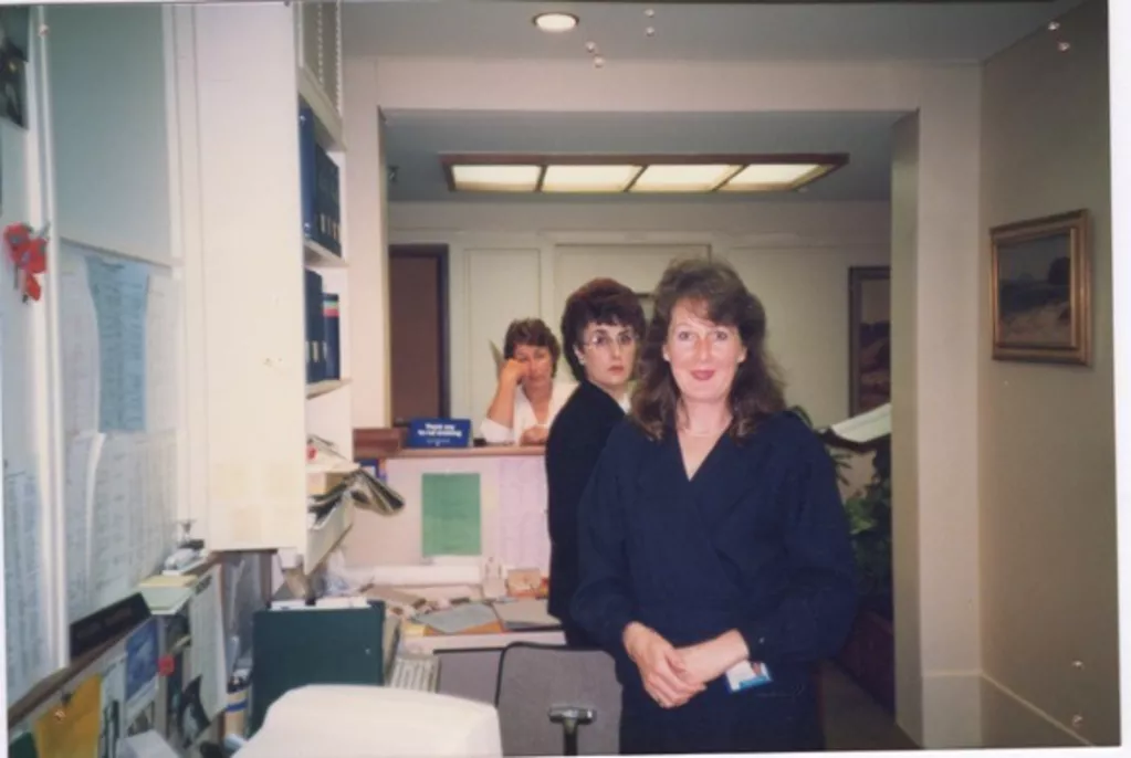 Staff members standing in a row, looking at the camera. Staff members standing in a row, looking at the camera.