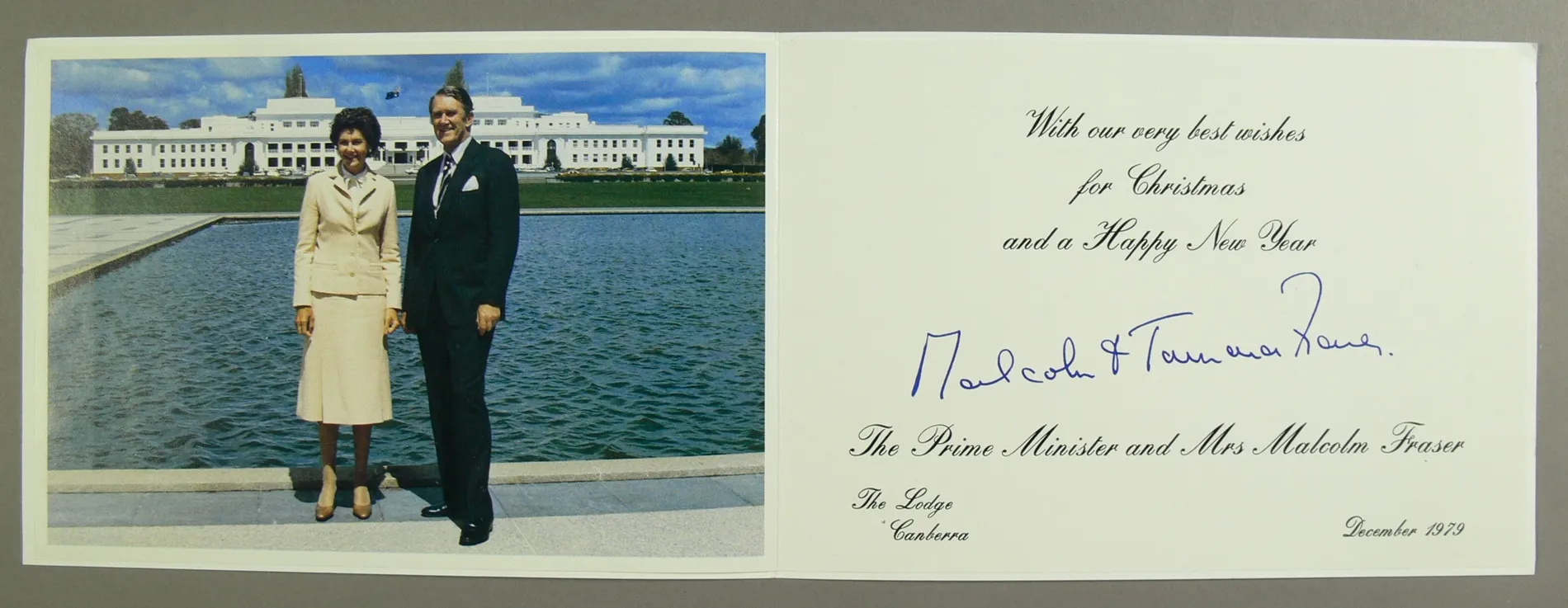 A Christmas card featuring a photo of Malcolm and Tamie Fraser, standing at the reflection pool in front of Old Parliament House. A Christmas card featuring a photo of Malcolm and Tamie Fraser, standing at the reflection pool in front of Old Parliament House.