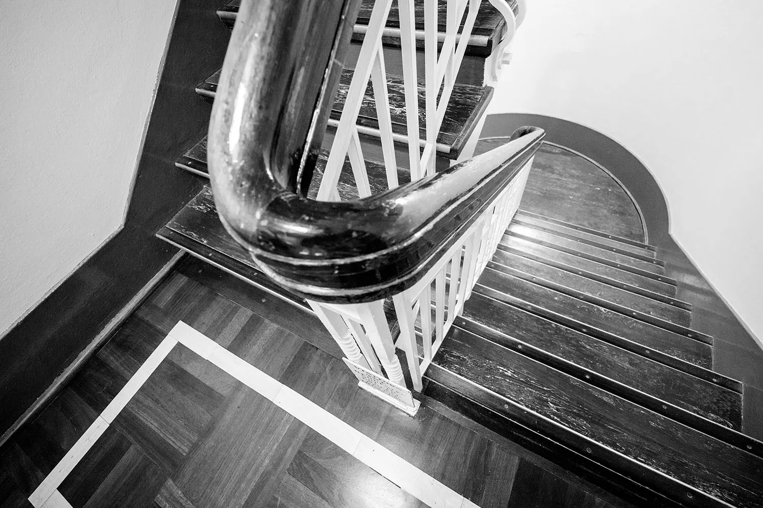 Detail of a curved banister on a flight of stairs in Old Parliament House. 