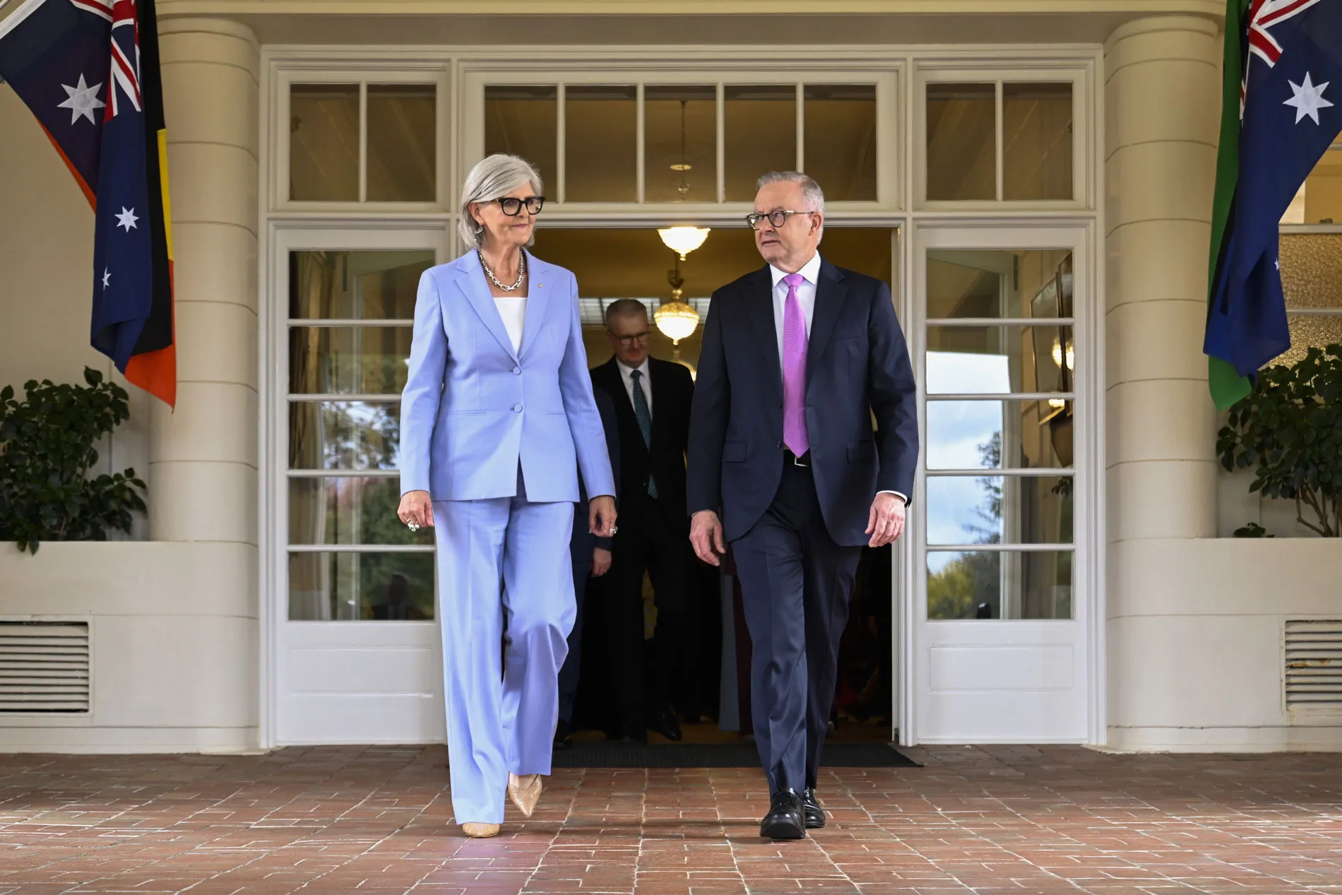 Governor-General Sam Mostyn and Prime Minister Anthony Albanese walk outside Government House in Canberra.