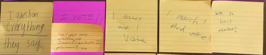 A grid of Post-it notes with visitors's thoughts on democracy. 