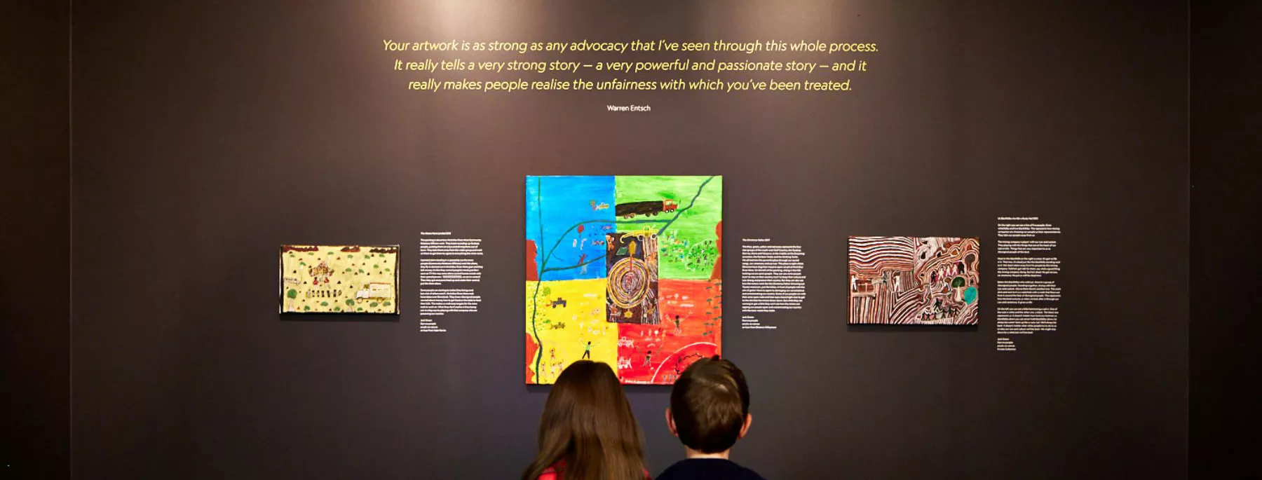 Two children looking at one of the features
