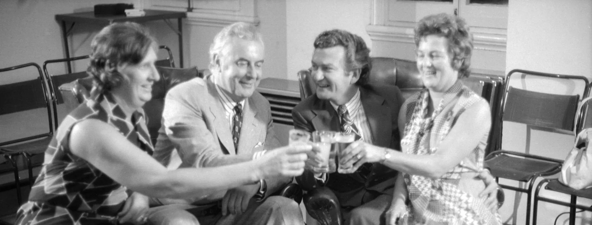 Gough and Margaret Whitlam clink their glasses with Bob and Hazel Hawke.
