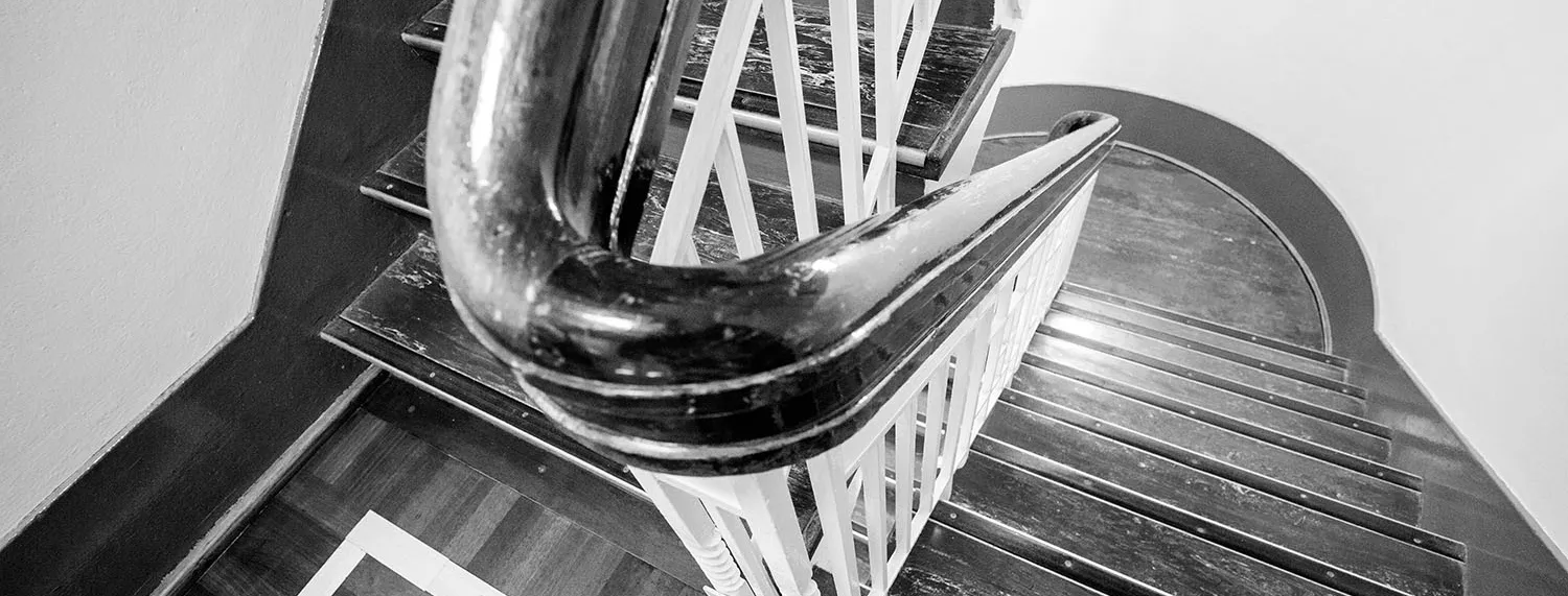 Detail of a curved banister on a flight of stairs in Old Parliament House. 