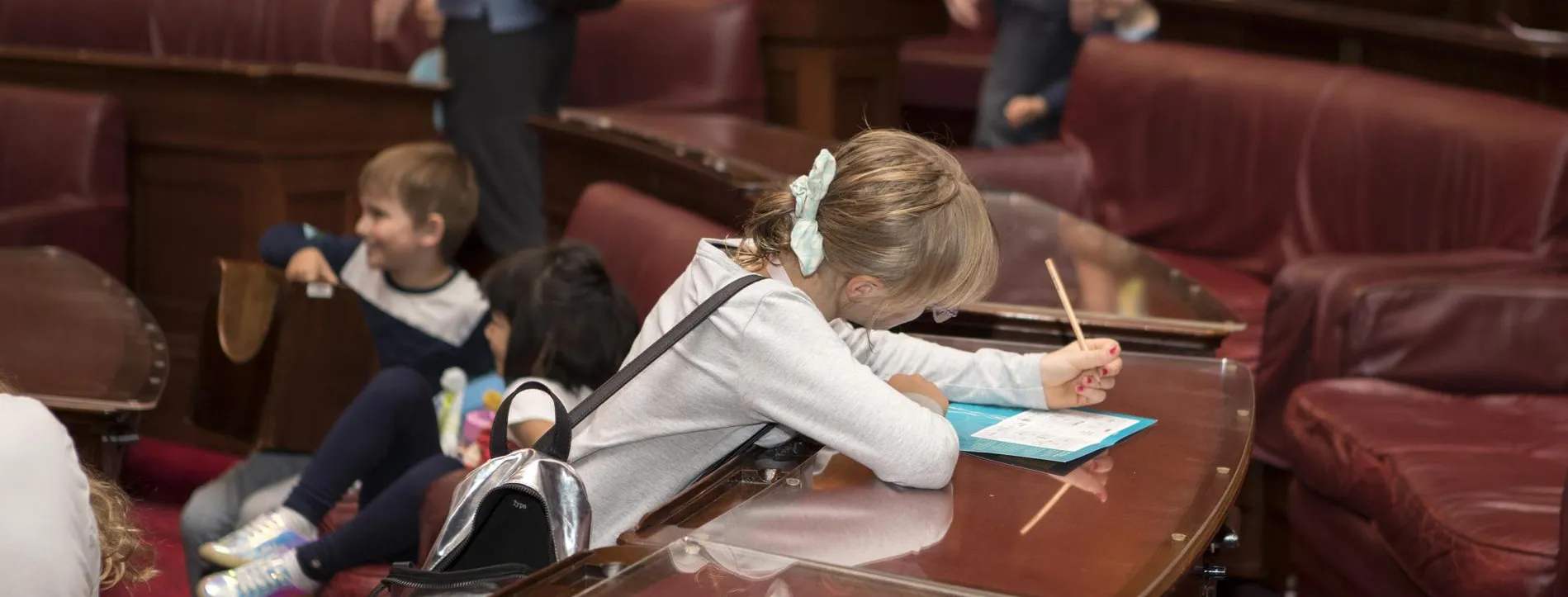 A young visitor working on an activity on one of the trails.