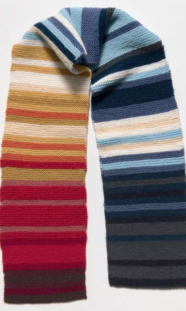 A knitted blue, white and red scarf. A knitted blue, white and red scarf.