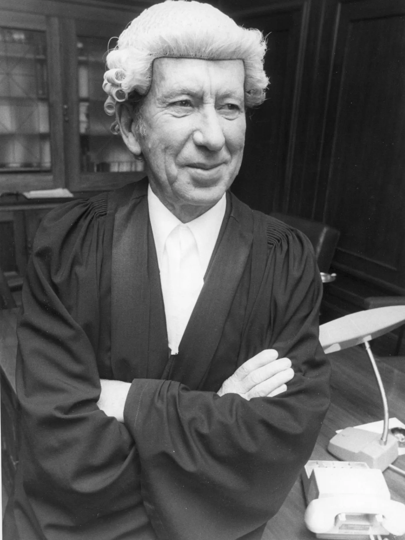 Clerk of the Senate James Odgers in his office at Parliament House, 1976.
Photograph Sydney Morning Herald Clerk of the Senate James Odgers wearing a black gown and white wig sits on his desk at Old Parliament House around 1976.