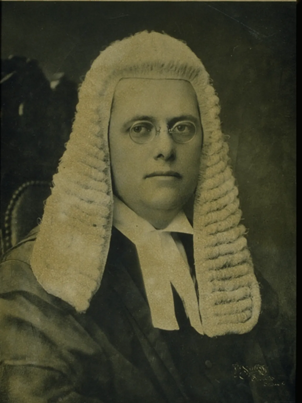 A black and white image of Herbert Evatt sitting, wearing the wig work by the Speaker of the House of Representatives.