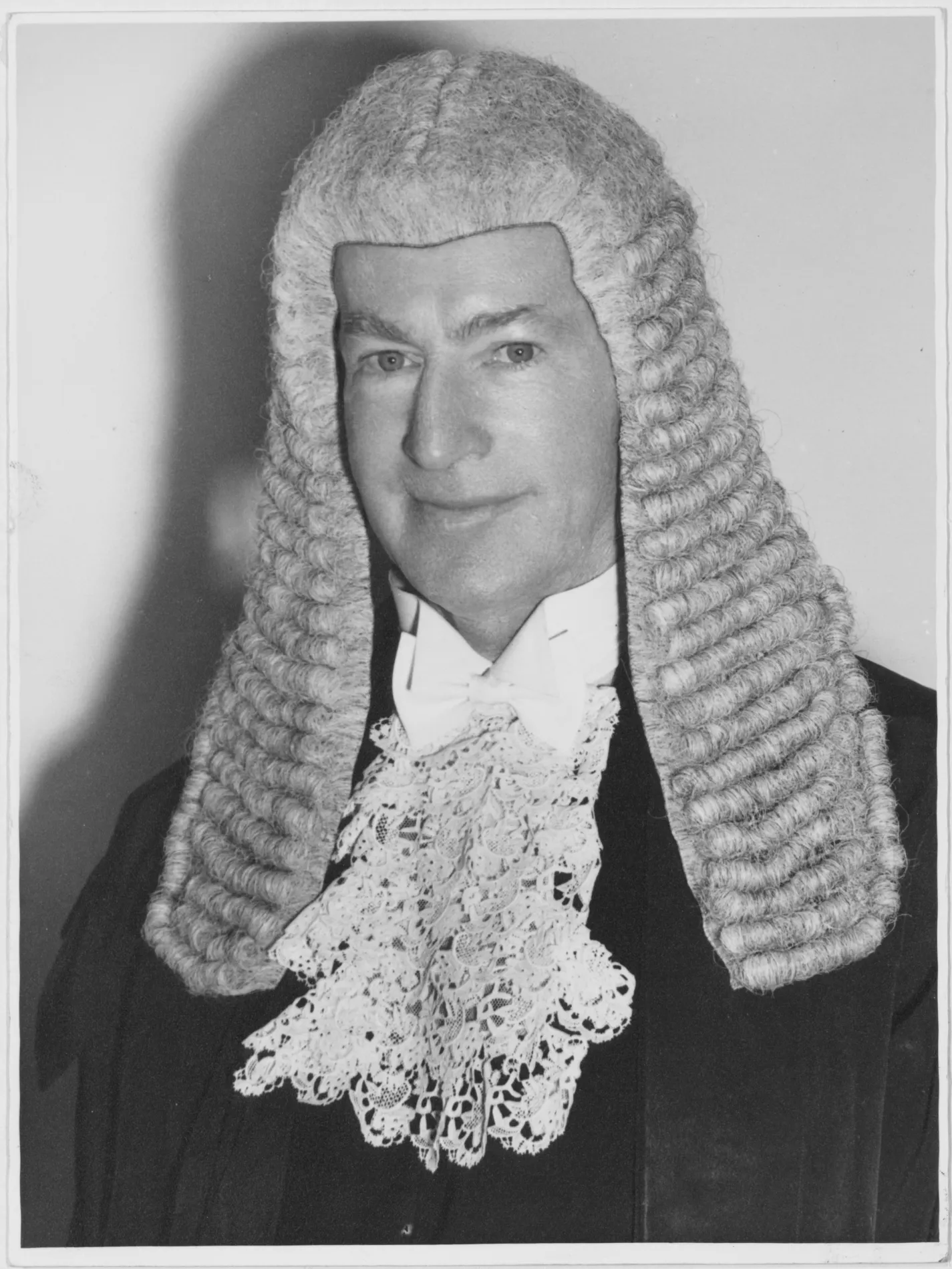 A black and white image of Sir Walter Nairn wearing the wig worn by the Speaker of the House of Representatives.