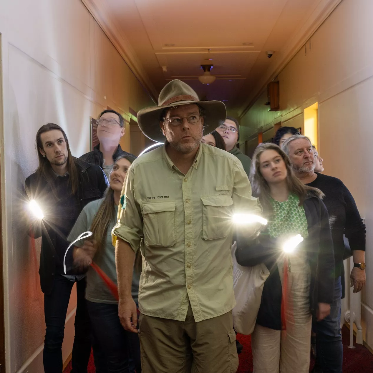 Tim the Yowie Man leading a group of people down a corridor in Old Parliament House. Tim the Yowie Man leading a group of people down a corridor in Old Parliament House.