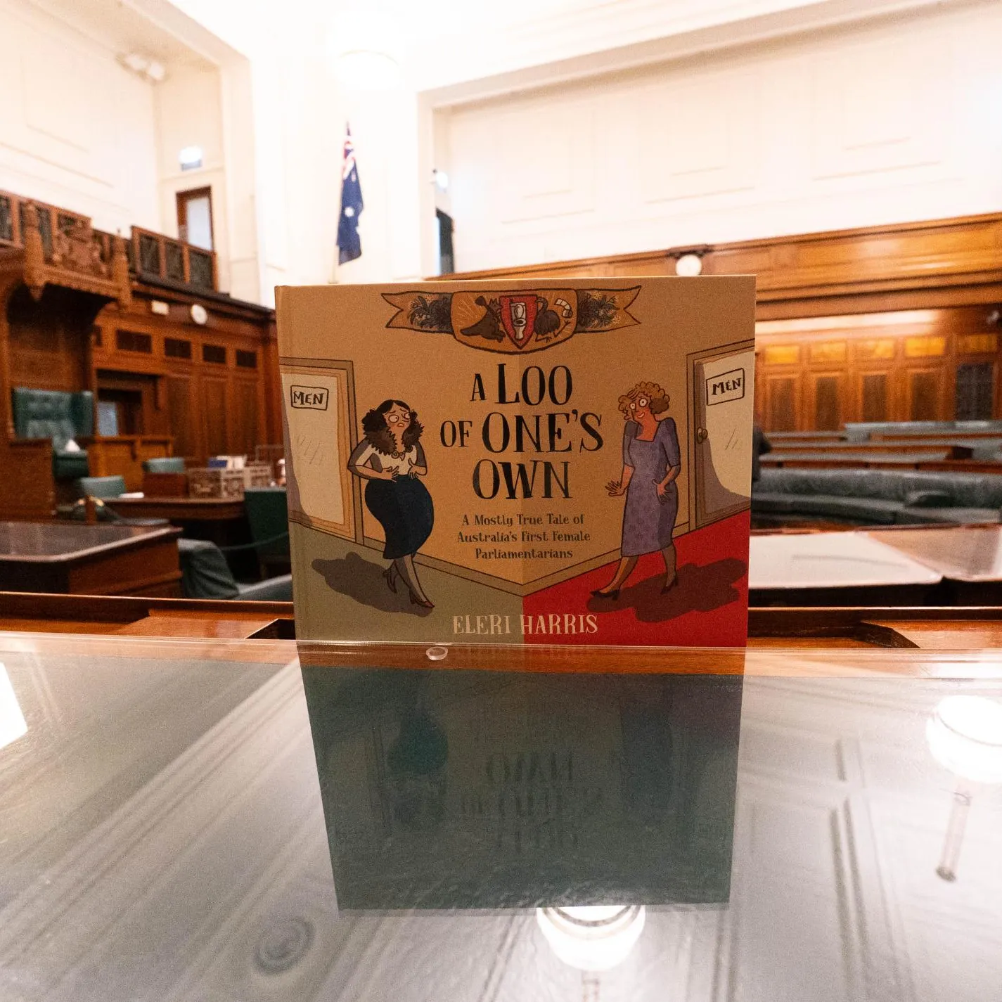 A Loo of One's Own book by Eleri Harris picture in the House of Representatives in Old Parliament House.