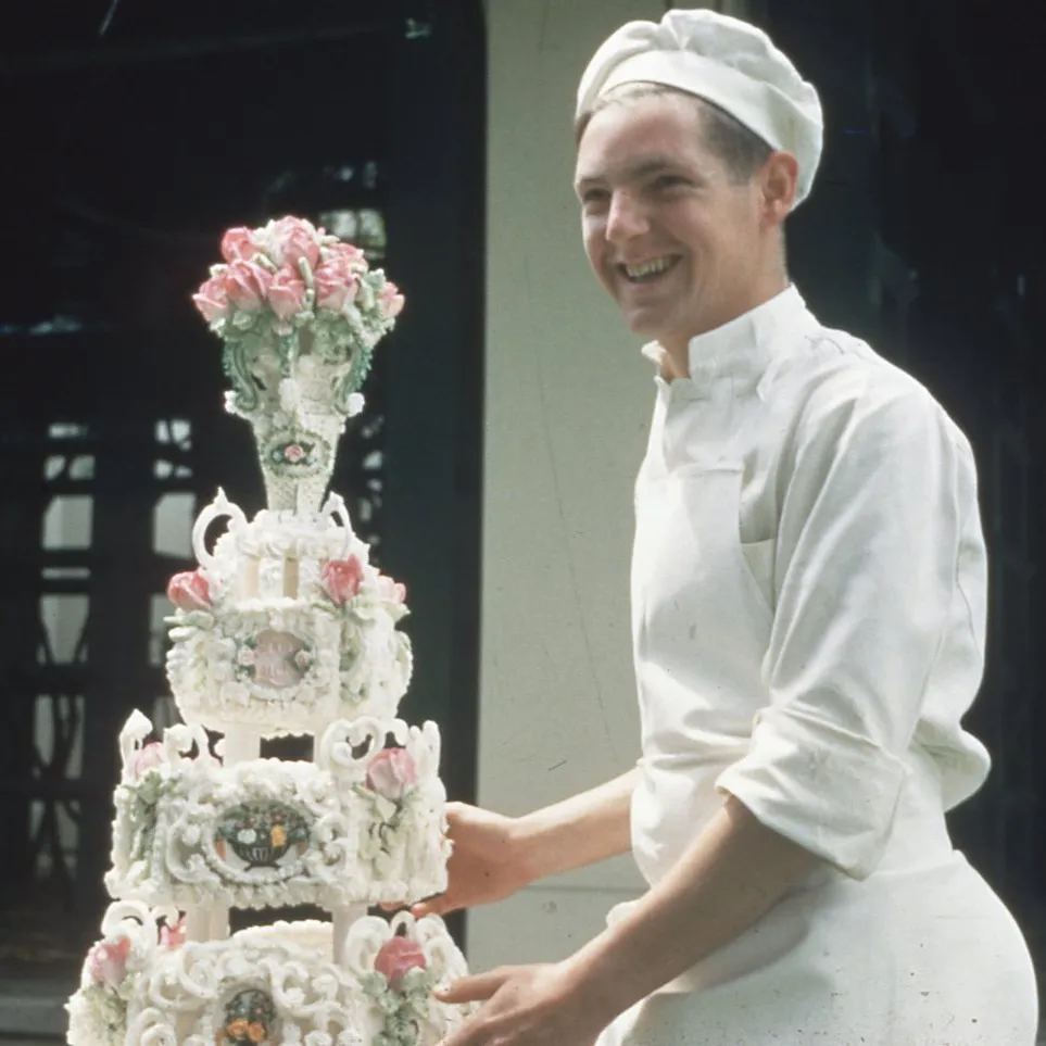 Chef at Old Parliament house with a decorated cake