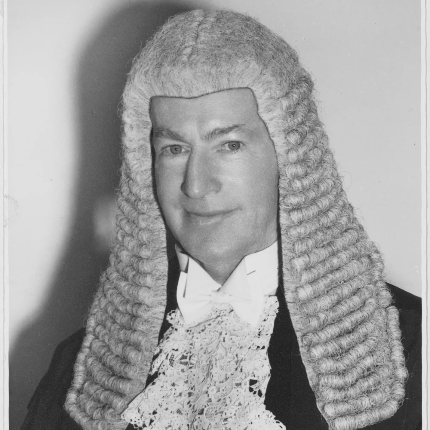 A black and white image of Sir Walter Nairn wearing the wig worn by the Speaker of the House of Representatives.