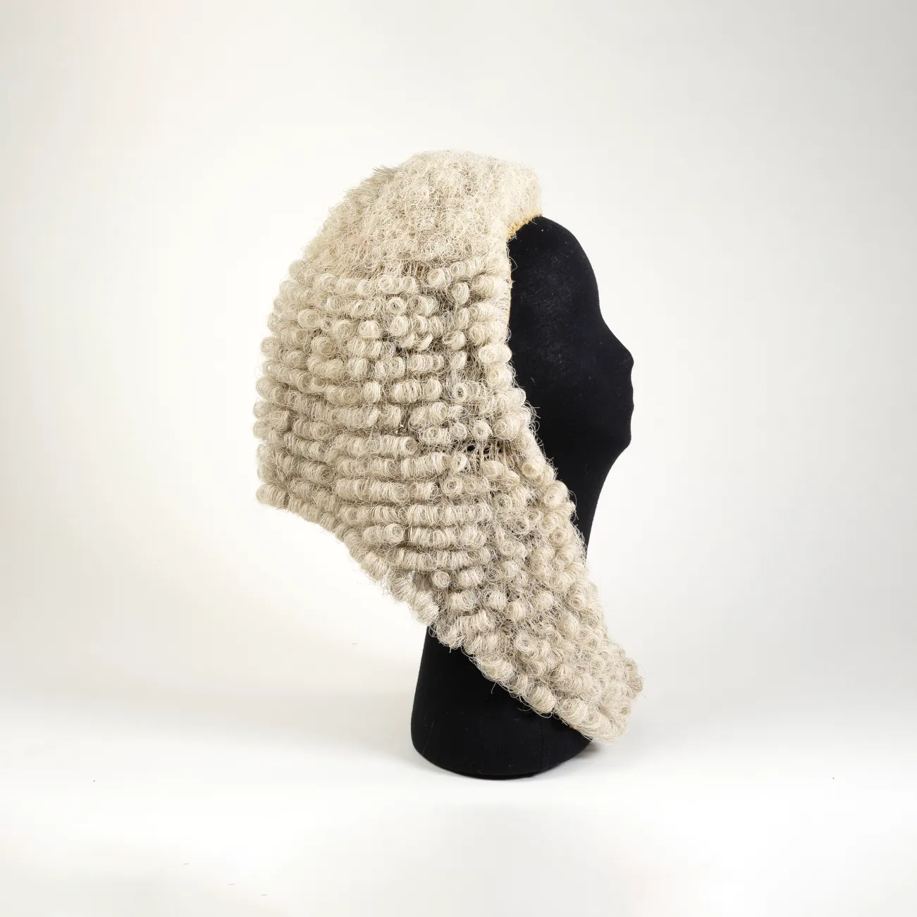 An image of the wig worn by the Speaker of the House of Representatives on a mannequin head