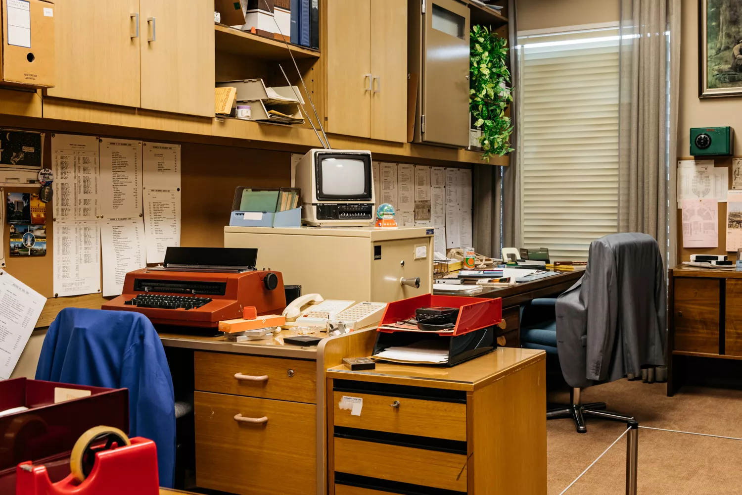 A corner of an office like its from the 1980s with typewriters, cassette tapes, small TVs and 80s fashion. A corner of an office like its from the 1980s with typewriters, cassette tapes, small TVs and 80s fashion.