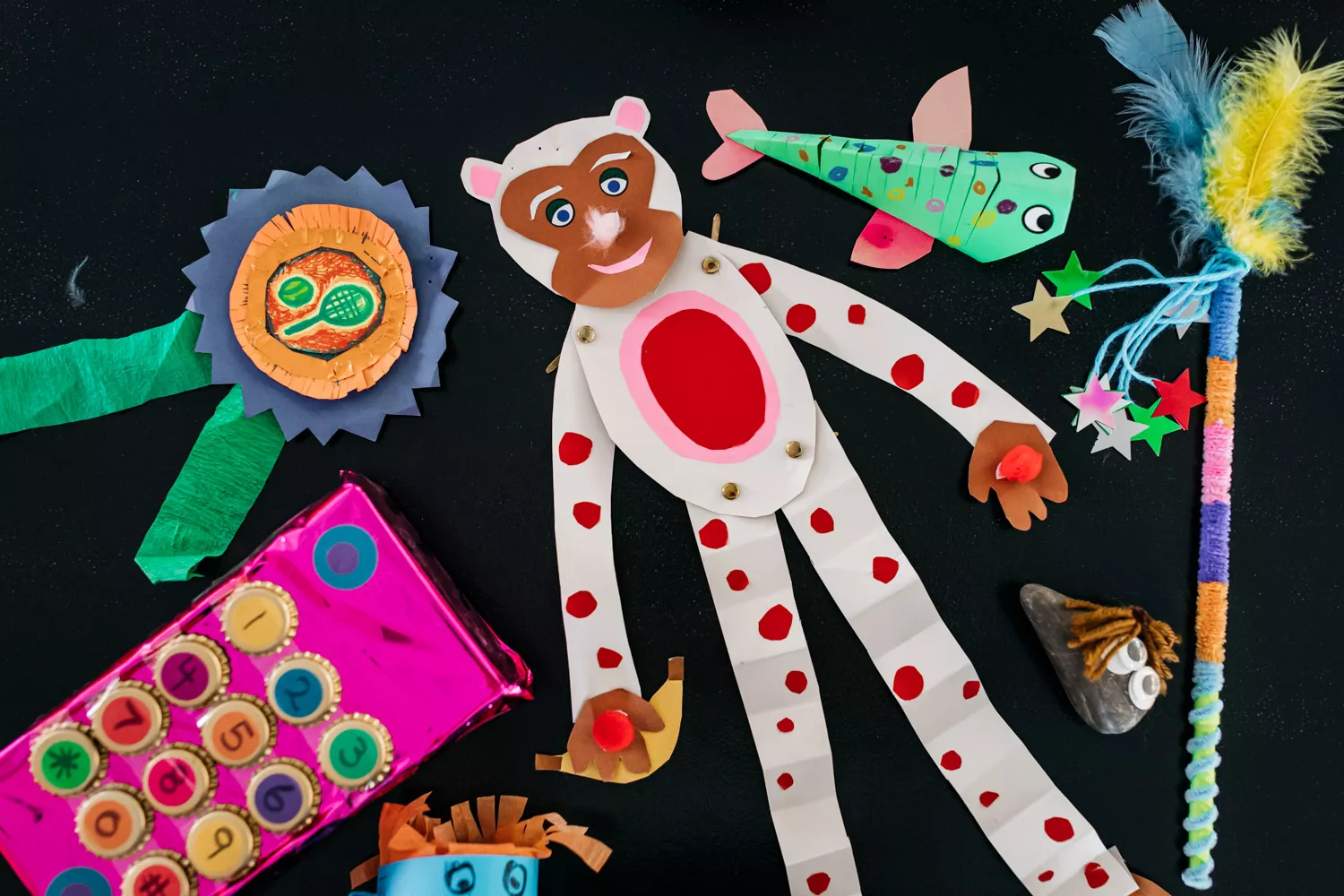 A paper monkey, fish and medal. A paper monkey, fish and medal.