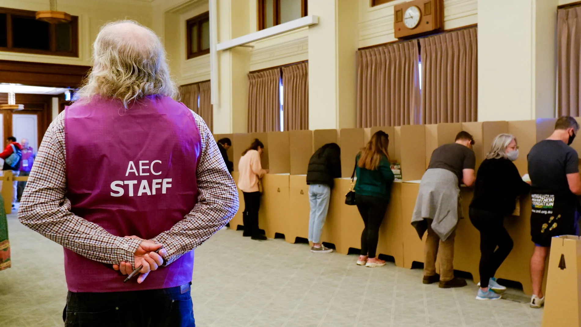 An AEC staff members observes people voting in booths at Old Parliament House. An AEC staff members observes people voting in booths at Old Parliament House.